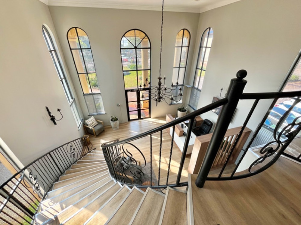 View down the sweeping staircase into The Chambers reception
